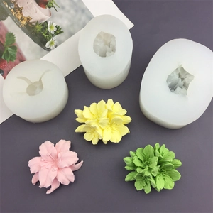 Silicone flower molds for fondant and candles with sample yellow and pink cherry blossoms