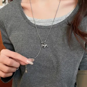 Silver horse pendant Y-necklace with snake chain and adjustable gold charm on model