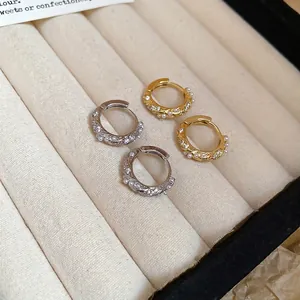 Twisted pearl and zircon hoop earrings in gold and silver finish for women