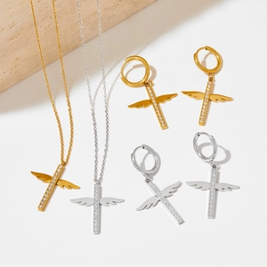 Gold and silver angel wing cross jewelry set with necklace and hoop earrings