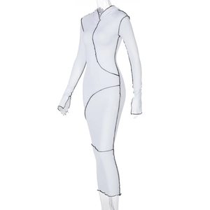 Detailed view of white hooded dress featuring black contrast stitching and thumbhole cuffs
