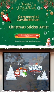 Detail of Christmas tree and snowman UV stickers on a glass window with festive text