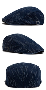 Three-view display of vintage denim flat cap with white contrast stitching and side buckles