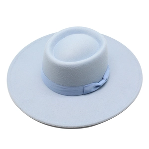 Close-up of light blue wool felt jazz hat featuring a matching ribbon bow and wide brim