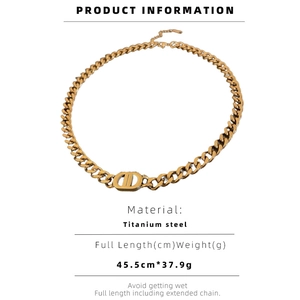 Macro view of gold titanium steel link chain featuring circular CD buckle detail