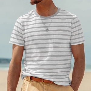 Close-up of grey and white striped cotton T-shirt featuring a front chest pocket detail