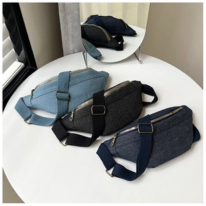 Detailed view of casual denim waist bags in light blue, dark blue and charcoal grey tones