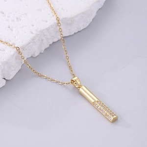 Modern 18K gold-plated cylinder necklace featuring a pavé-set cubic zirconia pendant charm