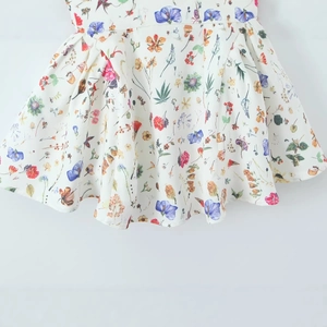 Slim fit floral sundress for women with colorful botanical prints and pleated waist details