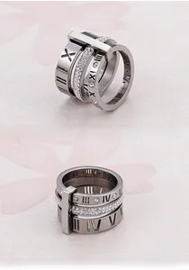Detail of multi-layer silver ring featuring roman numerals and pavé set cubic zirconia