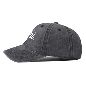 Close-up of side profile of dark grey washed cotton baseball cap with mimi embroidery