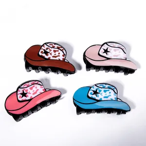 Cowboy hat hair claws with cow print and star design in four vibrant colors