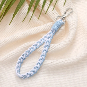 Close-up of handmade blue and white braided keychain lanyard with metal lobster clasp