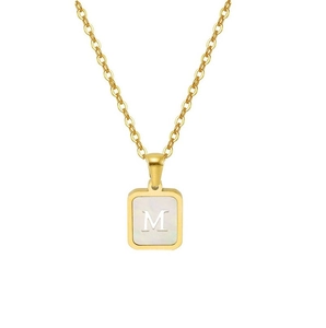 Detailed close-up of 18K gold stainless steel square pendant with shell inlay and letter M