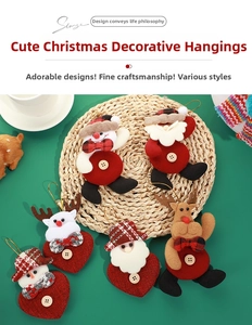 Detail of plush Christmas ornaments with felt texture and wooden button accents