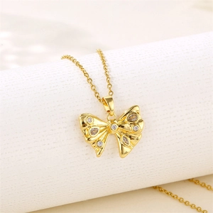 18K gold plated bow necklace for women featuring sparkling zircon stones on a white stand