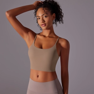 Close-up of mocha sports top with thin straps and elastic fabric for fitness training