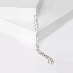 Detail of silver wheat ear brooch featuring crystal rhinestones and long tassels