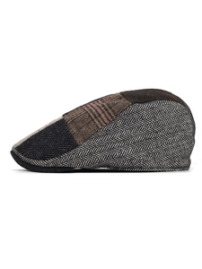 Side view detail of a retro patchwork ivy cap featuring tweed and herringbone textures