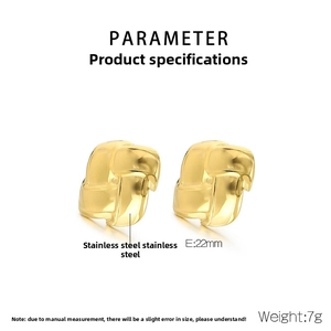 Detailed macro view of 22mm gold stainless steel earrings with woven texture and 7g weight