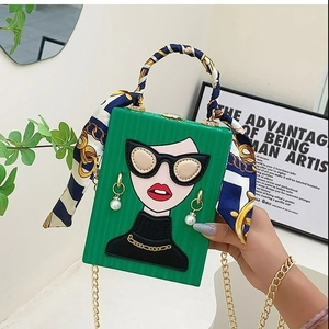 Green graffiti evening clutch bag with pearl accents and silk scarf wrapped handle