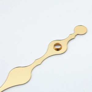 Polished gold metal clock hands set with vintage Breguet style design on white background