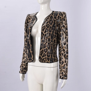 Detail view of leopard print sequin blazer with long sleeves and shimmering golden texture