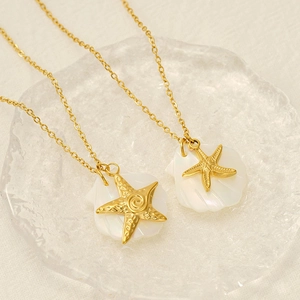 Starfish shell double layer necklace in 18K gold plated stainless steel on a tray