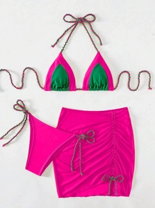 Detailed flat lay of three-piece bikini set with color blocking and drawstring skirt