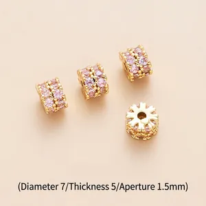 Detail view of 7mm brass spacer beads with pink zircons for DIY jewelry making