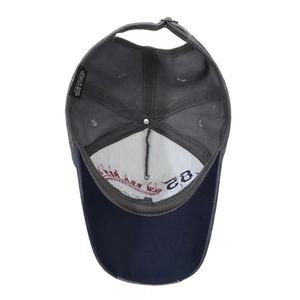 Navy blue and grey washed cotton baseball cap showing internal lining and stitching