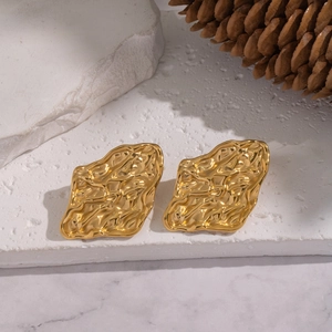 Detailed view of 18K gold plated stainless steel stud earrings with hammered texture on stone