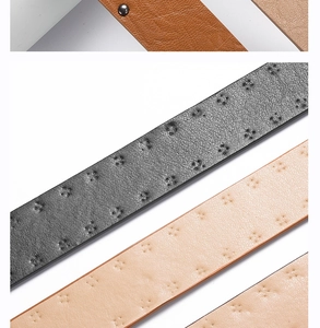 Close-up of the vintage punk black leather belt showing double rivet buckle and texture