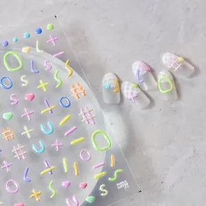 Detail of 3D embossed jelly nail stickers featuring colorful cream lines and heart shapes