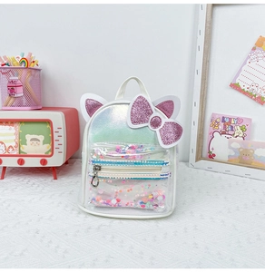 Close-up of cute cat ears backpack featuring colorful sequins and laser texture finish