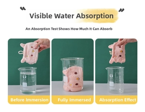 Absorbency test of a pink coral fleece hand towel showing high water suction capacity