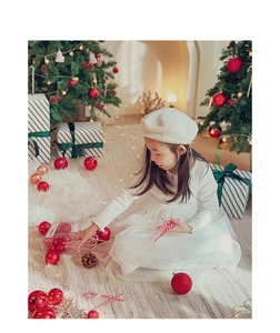 White tulle princess dress and beret set shown in a cozy Christmas scene with ornaments