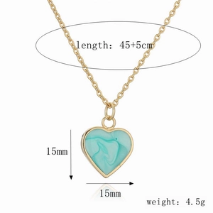 Detail view of heart pendant with teal marble texture showing 15mm size and 45cm chain