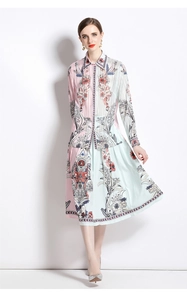 Detail of floral print silk-textured blouse and pleated midi skirt two-piece set