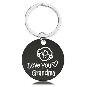 Macro detail of black metal keychain with Love You Grandma engraving and heart icon