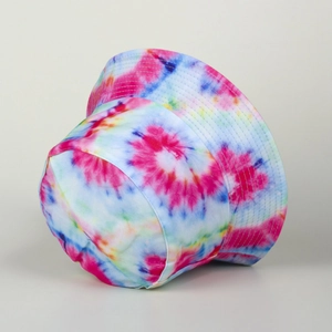 Detailed view of rainbow tie-dye bucket hat featuring reinforced stitching and cotton texture
