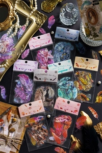 Macro shot of 40-piece feather PET stickers for scrapbooking in vintage mystical style