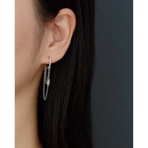 Macro shot of S925 sterling silver chain tassel earrings with sparkling zircon accents