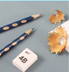 Macro shot of 4B soft eraser and navy blue dotted pencils for posture correction