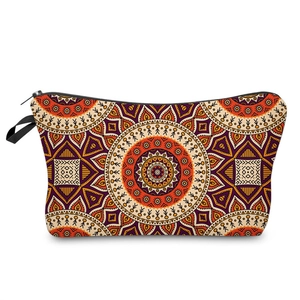 Toiletry bag with orange and purple tribal mandala pattern and black zipper closure