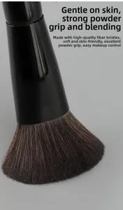 Macro shot of dual-ended makeup brush with soft synthetic bristles and glossy black handle