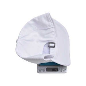 Detailed view showing the lightweight 86.1g build of the white cotton baseball cap
