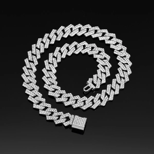 Macro detail of silver iced out Cuban link chain necklace with sparkling square clasp