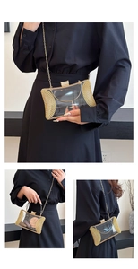 Detail of clear acrylic evening clutch with gold metal frame and sparkling rhinestones