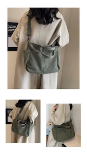 Detail of army green corduroy tote bag featuring wide shoulder straps and side pocket